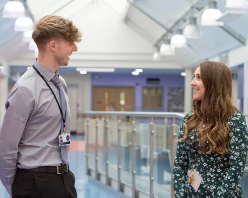 Student talking to member of staff