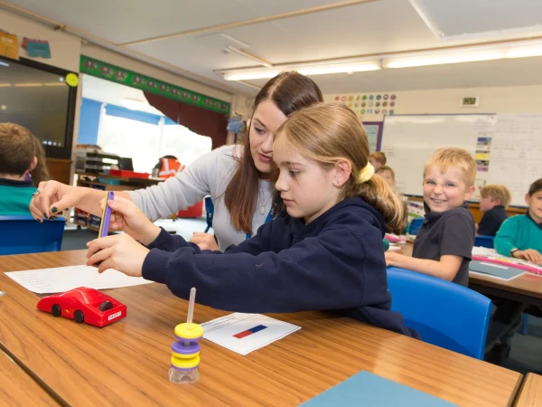 Teacher with pupil