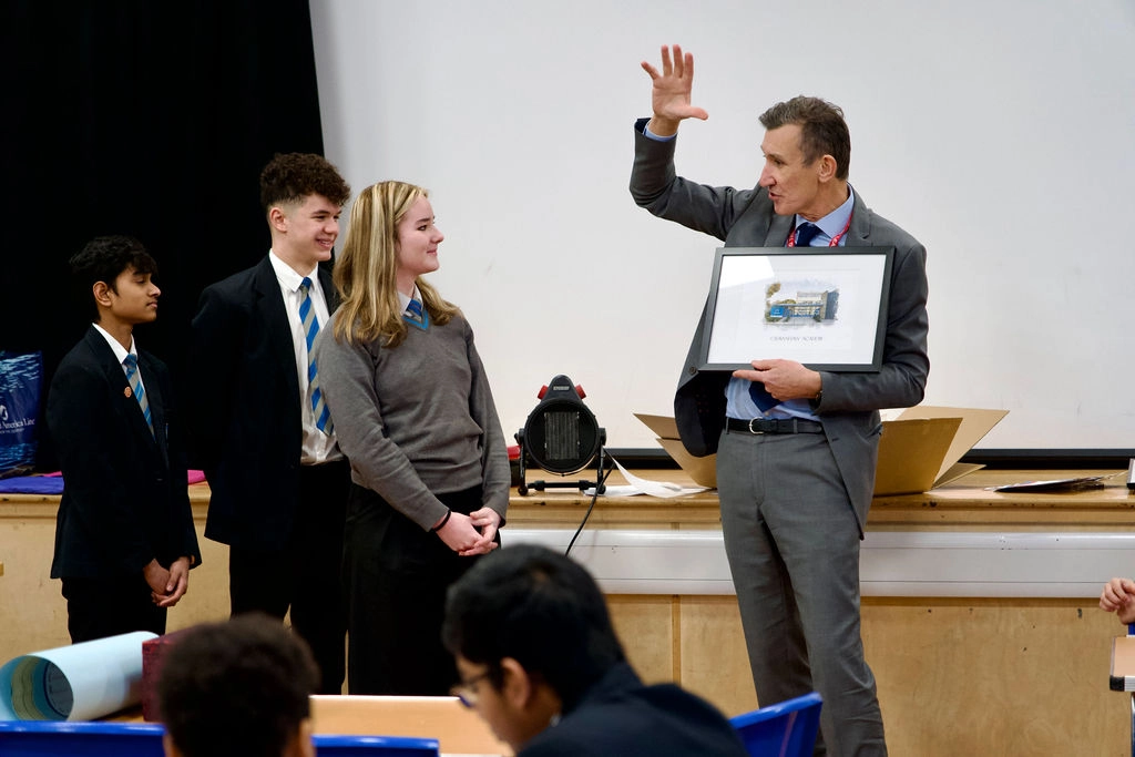 Richard Sheriff receives gifts from Crawshaw pupils